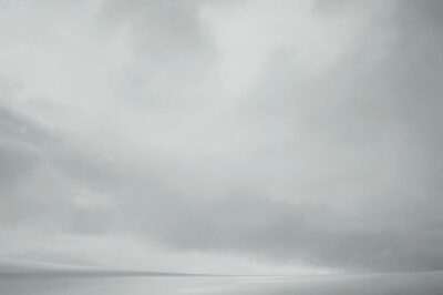 cloudy sky and snow-covered glacier, the Kenai Fjords, Alaska