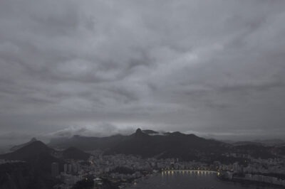 view of downtown Rio de Janeiro from Sugarloaf Mountain, twilight, a grey and cloudy sky